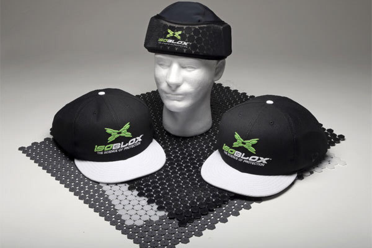 The new IsoBLOX protective caps for baseball players include full-size caps and a youth-level protective skull cap for under a standard fielder's cap.