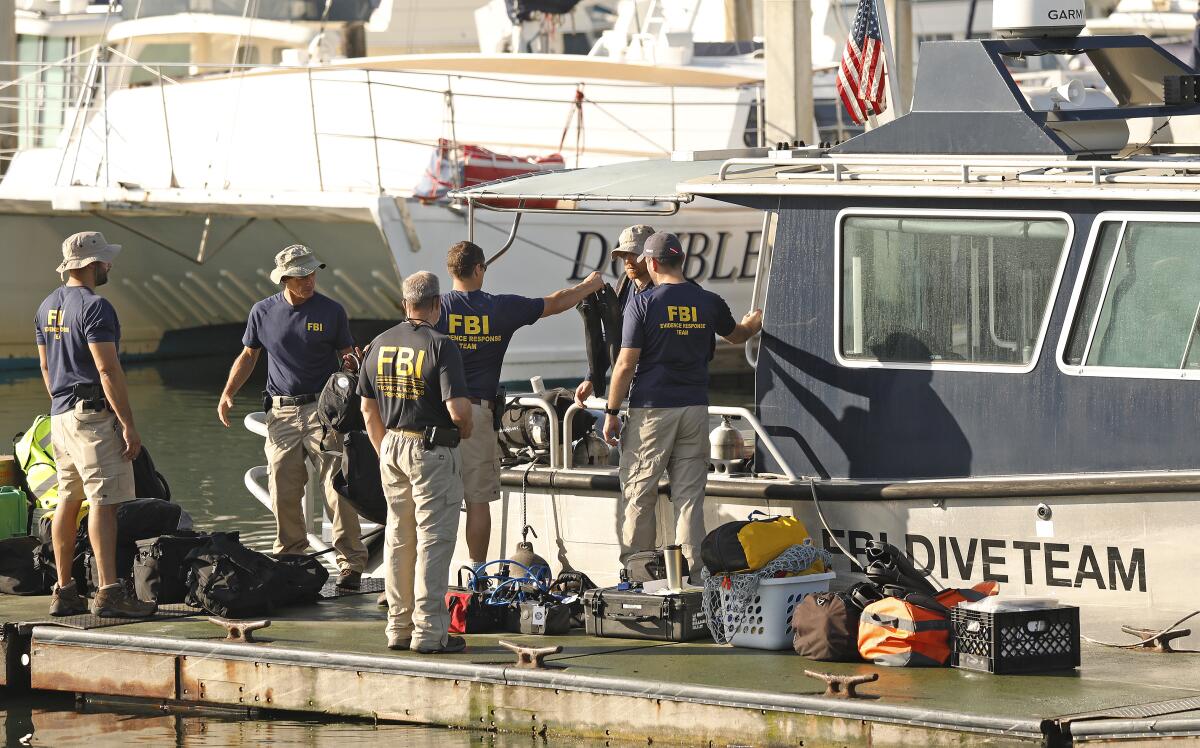 FBI dive team members prepare to go to the site of the dive boat Conception