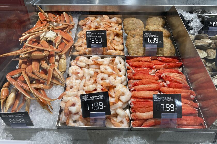 Fresh seafood is shown for sale at a grocery store, Wednesday, July 27, 2022, in Surfside, Fla. The economy shrank in the first half of this year, underscoring fears of a broad-based slowdown that could lead to a recession. At the same time, the number of people seeking unemployment benefits fell to a five-month low. Inflation, meantime, remains near its highest level in four decades, though gas costs and other prices have eased in recent weeks. (AP Photo/Wilfredo Lee)