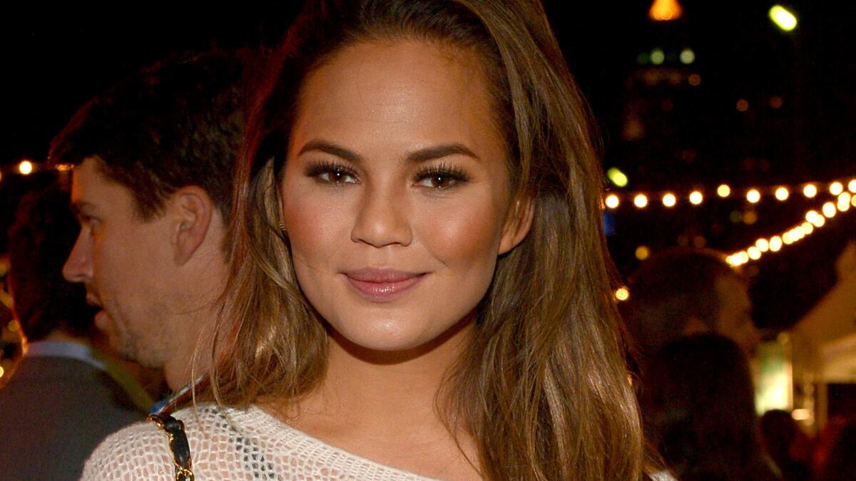 Chrissy Teigen didn't apologize for a Wednesday tweet criticizing U.S. gun laws in the context of the Ottawa shooting, but she did take a Twitter timeout Thursday after being hit with a "sea of hate and anger."