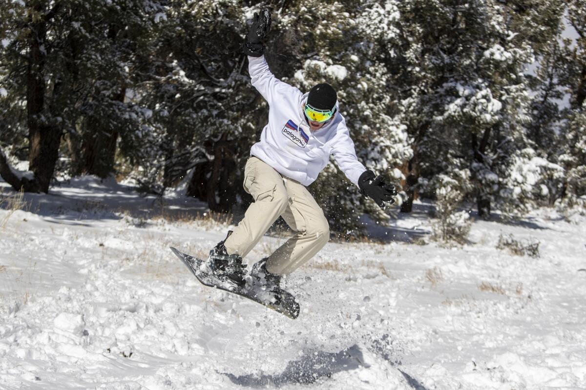 Jake Kentner, 20, backcountry snowboards with friends in some fresh snow near Big Bear Lake.