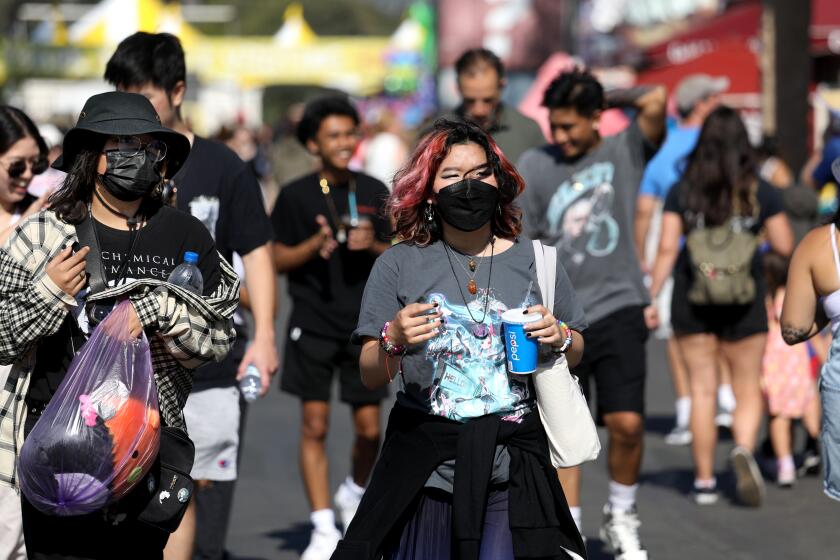 COSTA MESA, CA - JULY 15: Guests hit the midway on opening day at the Orange County Fair at the Costa Mesa fairgrounds on Friday, July 15, 2022 in Costa Mesa, CA. (Gary Coronado / Los Angeles Times)