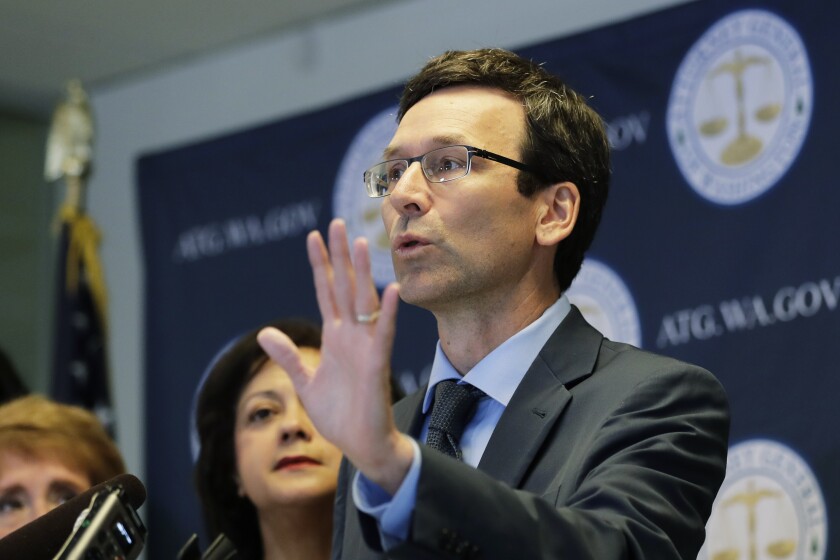 FILE - Washington Attorney General Bob Ferguson talks to reporters, Monday, Aug. 26, 2019, during a news conference in Seattle. In a 5-4 decision Thursday, Jan. 20, 2022, the Washington Supreme Court upheld an $18 million campaign finance penalty against the Consumer Brands Association, formerly known as the Grocery Manufacturers Association. Ferguson sued the group in 2013, alleging that it spent $11 million to oppose a ballot initiative without registering as a political committee or disclosing the source of the money. (AP Photo/Ted S. Warren)