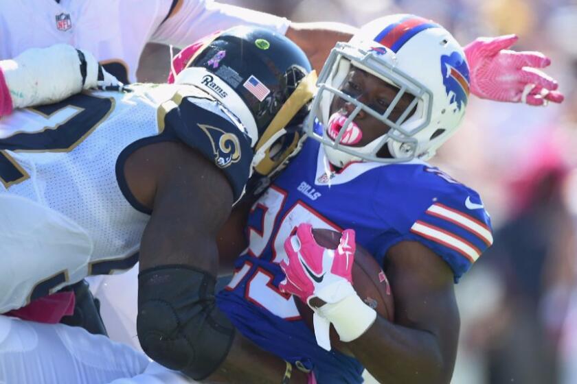 Rams cornerback Troy Hill hits Bills running back LeSean McCoy during a game on Oct. 9.