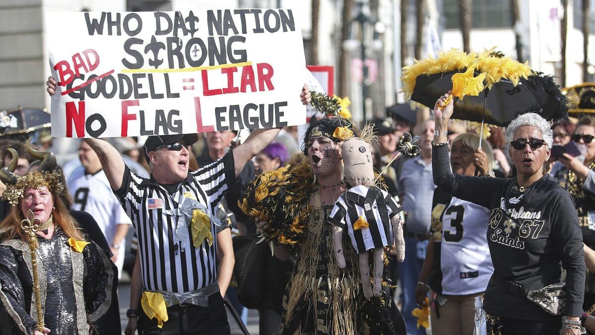 Saints fans make their way down Canal Street on Super Bowl Sunday.