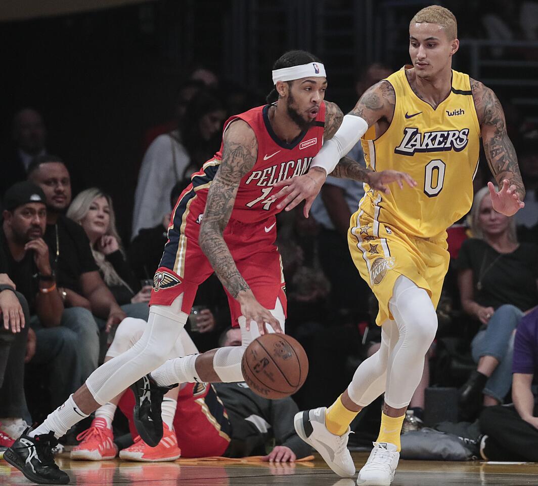 The Lakers' Kyle Kuzma shadows the Pelicans' Brandon Ingram, a former Laker, during the second quarter. Ingram finished with 22 points.