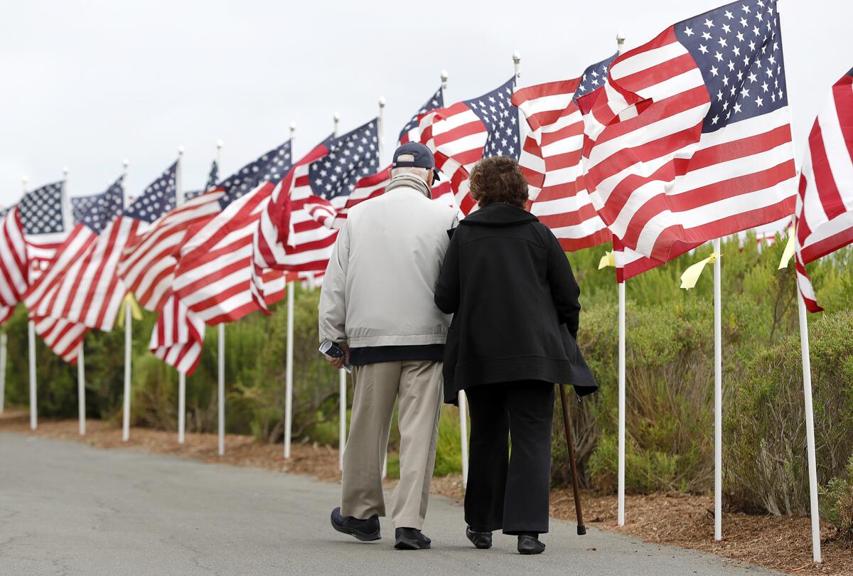 Veteran Bill Moodie and his wife, Helen, visit the Exchange Club of Newport Harbor's 13th annual Field of Honor.