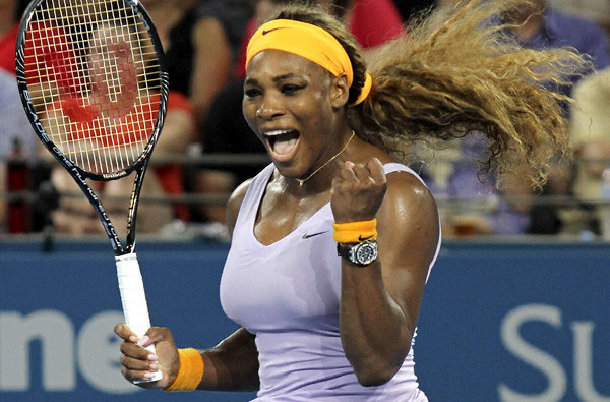 Serena Williams celebrates after defeating Victoria Azarenka to repeat as the Brisbane International champion on Sunday.