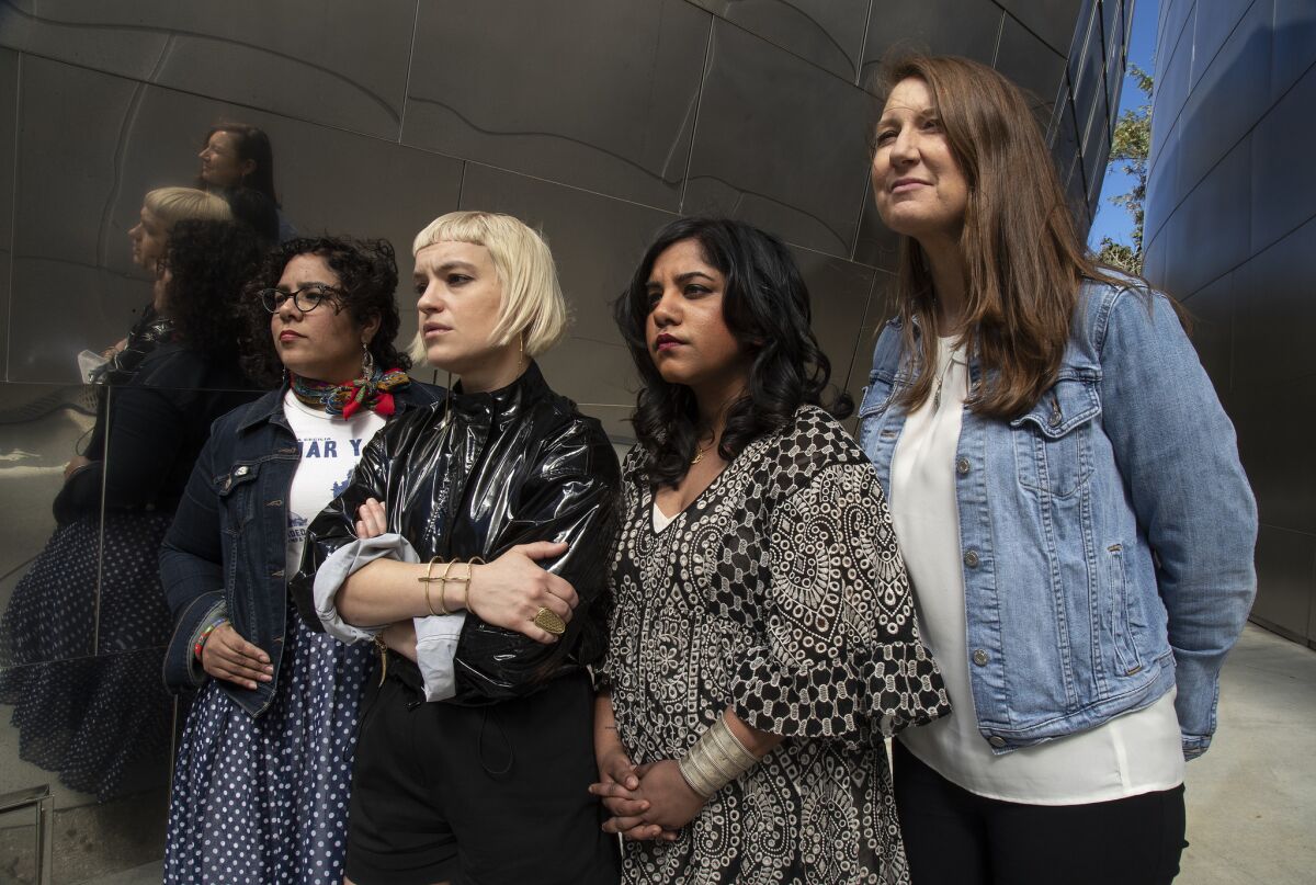 From left: Singer Marisoul Hernandez; Girlschool founder Anna Bulbrook; musical director Shruti Kumar; and L.A. Philharmonic director of presentations Johanna Rees are four of more than 75 women-identified participants in an upcoming tribute to Yoko Ono at Disney Hall.