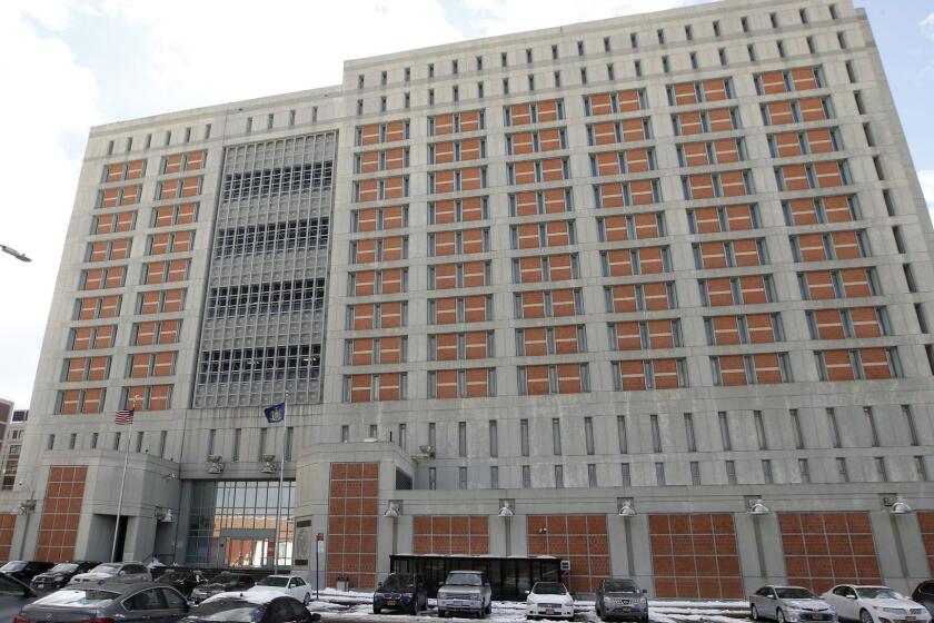 FILE- This Jan. 8, 2017 file photo shows the Metropolitan Detention Center (MDC) in the Brooklyn borough of New York. Hundreds of inmates at a federal jail in New York City have spent days in cold, dark cells amid frigid weather and without access to visitors or email, attorneys for the inmates said Friday, Feb. 1, 2019. (AP Photo/Kathy Willens, File)
