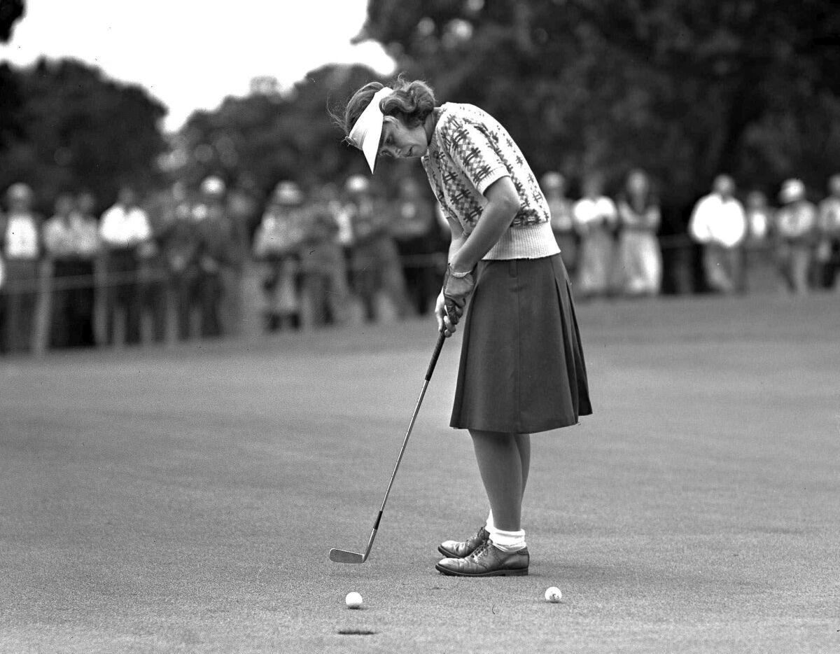 FILE - Shirley Spork sinks a short putt on the 18th green during second day of Women's Western Open Golf tournament at Des Moines, Iowa, in June 1946. Spork, one of the 13 founders of the LPGA Tour, died Tuesday, April 12, 2022, in Palm Springs, Calif., at age 94. (AP Photo, File)