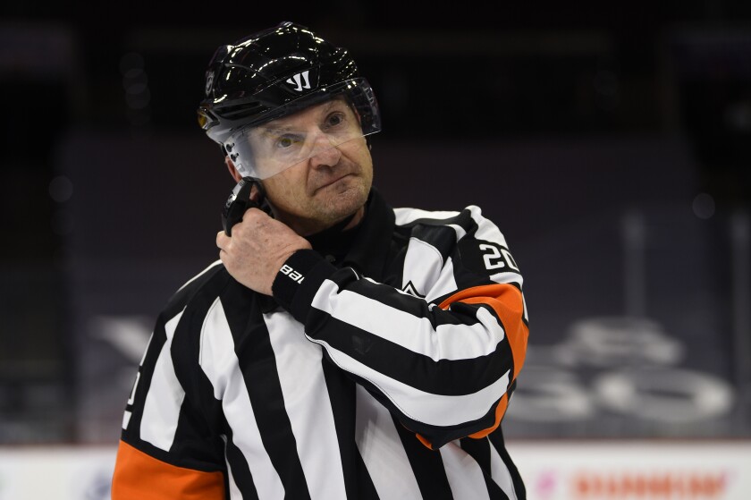 NFL referee Tim Peel on the ice during a game