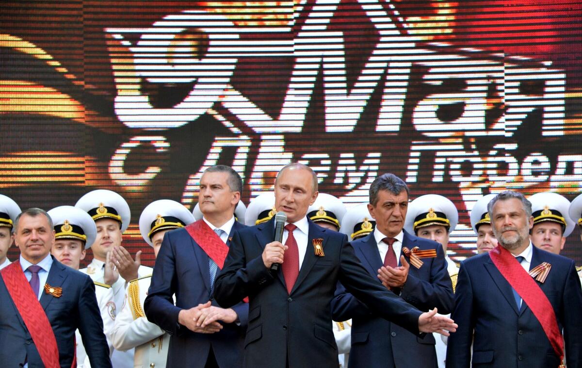 Russian President Vladimir Putin visited the seized Ukrainian territory of Crimea as part of Russia's Victory Day celebrations, drawing angry denunciations from the Kiev leadership and NATO.