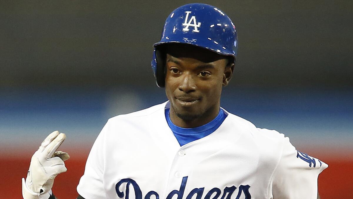 Dodgers second baseman Dee Gordon flashes a sign to his teammates after hitting a home run against the Detroit Tigers at Dodger Stadium in April. Gordon said he almost cried when he found out he had been selected to play in the MLB All-Star game.