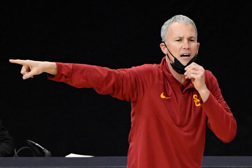 LAS VEGAS, NEVADA - MARCH 12: Head coach Andy Enfield of the USC Trojans gestures as his team takes on the Colorado Buffaloes during the Pac-12 Conference basketball tournament semifinals at T-Mobile Arena on March 12, 2021 in Las Vegas, Nevada. The Buffaloes defeated the Trojans 72-70. (Photo by Ethan Miller/Getty Images)