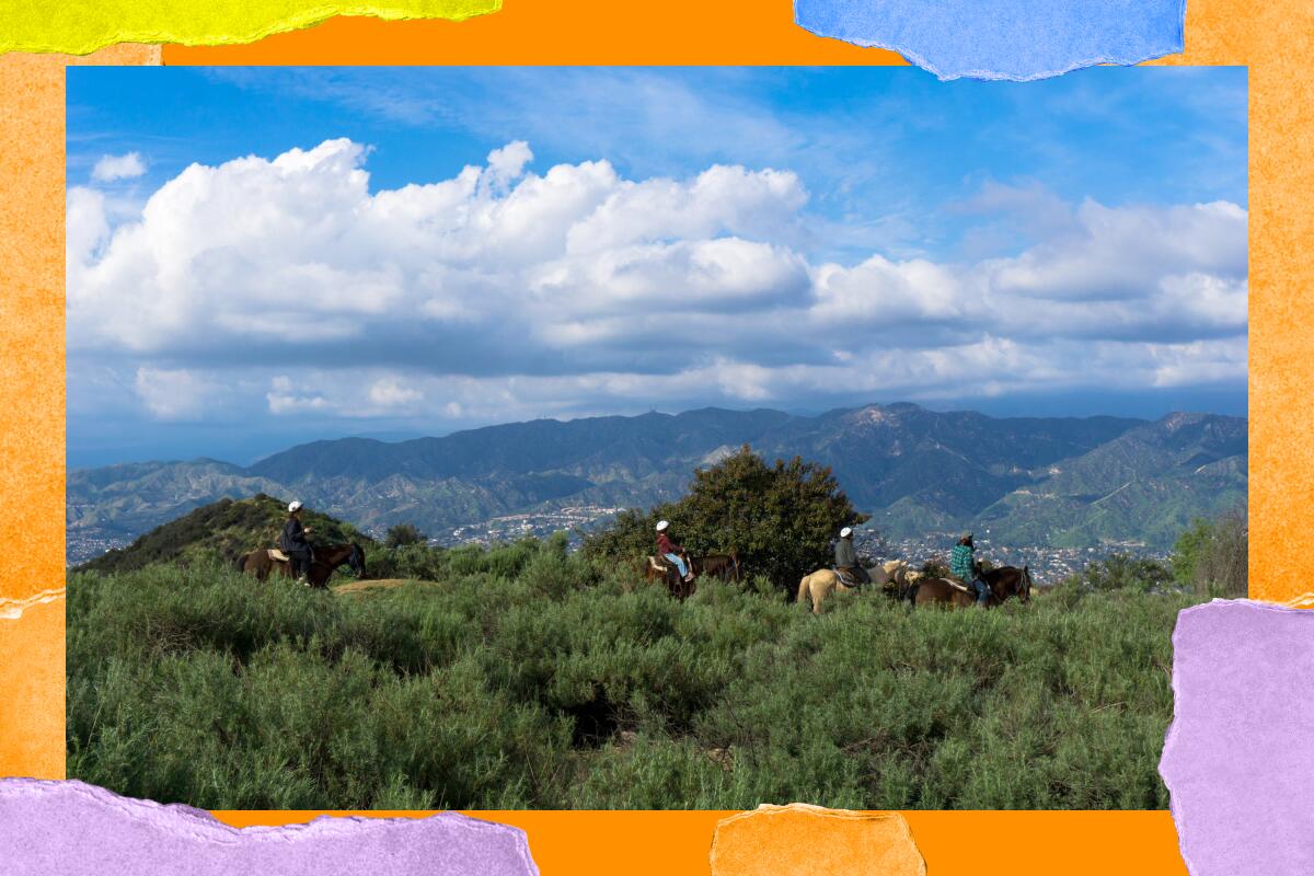 Equestrians on a mountain trail. In the distance are mountains, blue sky and clouds.