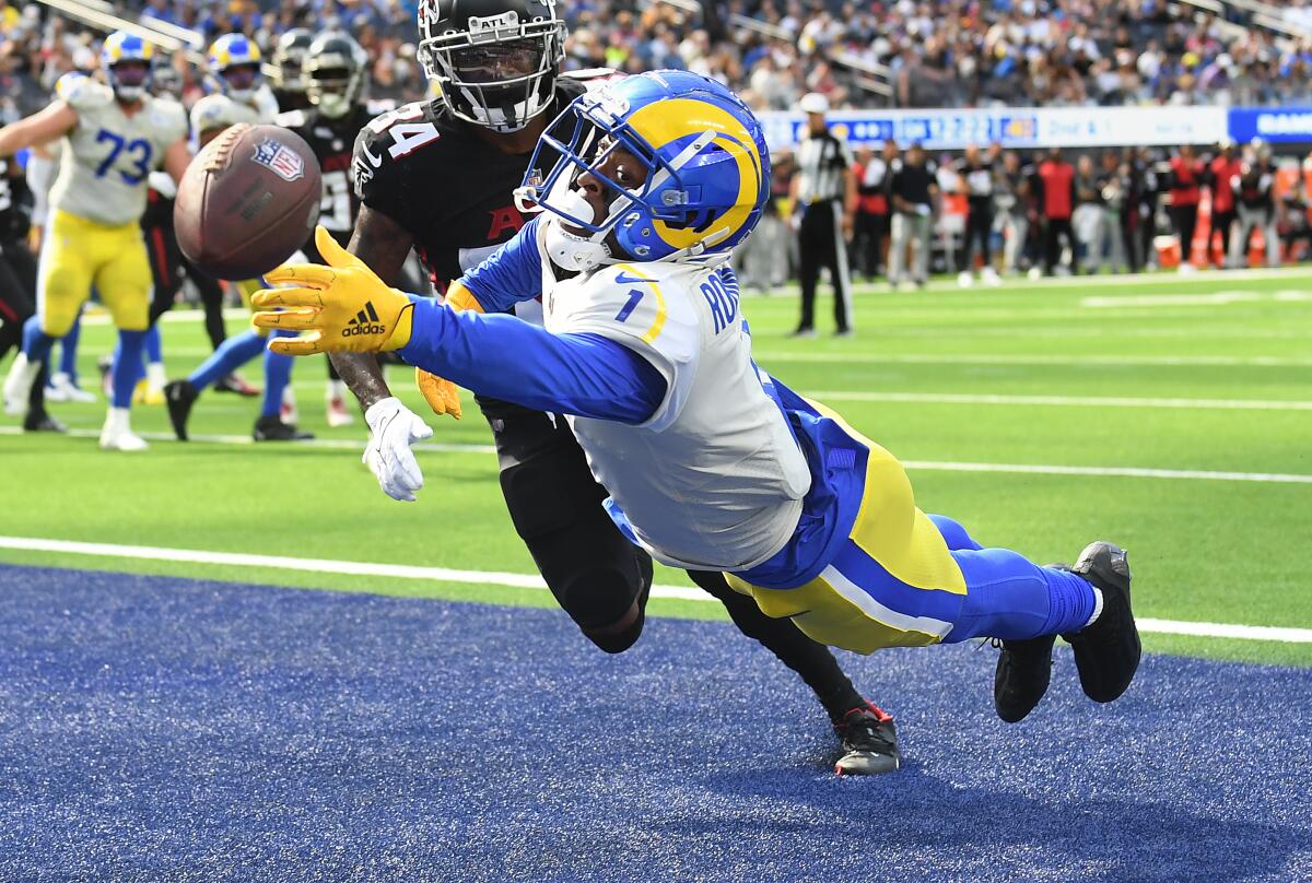 Rams receiver Allen Robinson dives but can't make the catch in the end zone in front of Falcons cornerback Darren Hall.