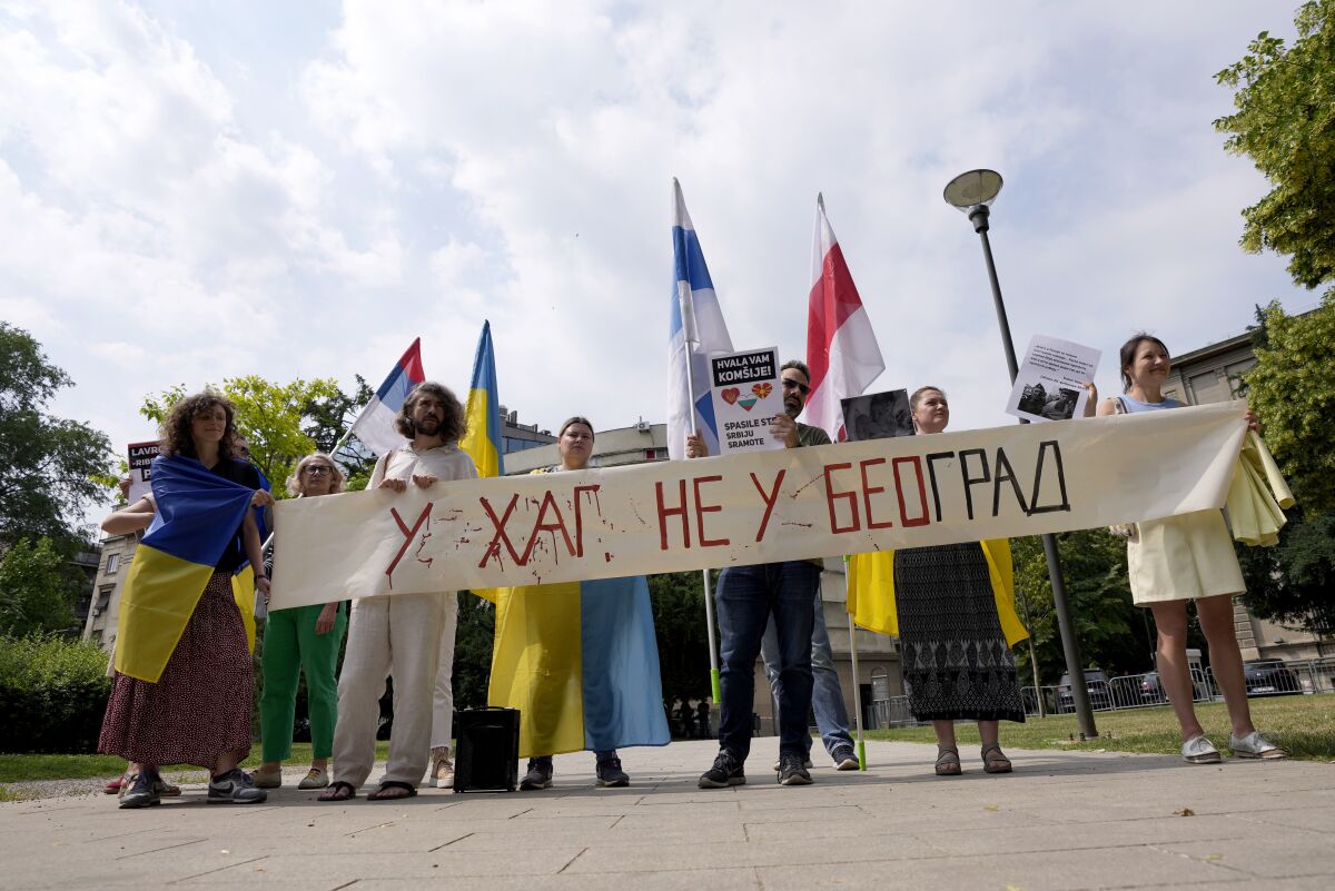 People holding an anti-Russian banner in Belgrade, Serbia