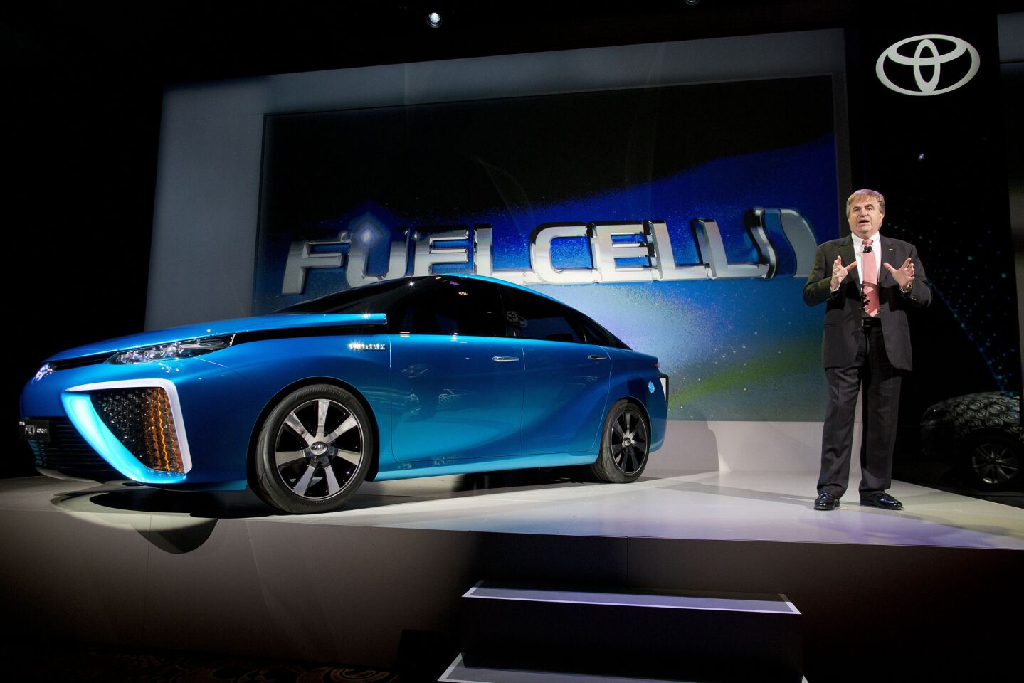 Toyota vice president and general manager Bob Carter talks about Toyota's FCV hydrogen electric concept car during the International Consumer Electronics Show in Las Vegas. Carter announced the car would be be available to consumers in 2015.