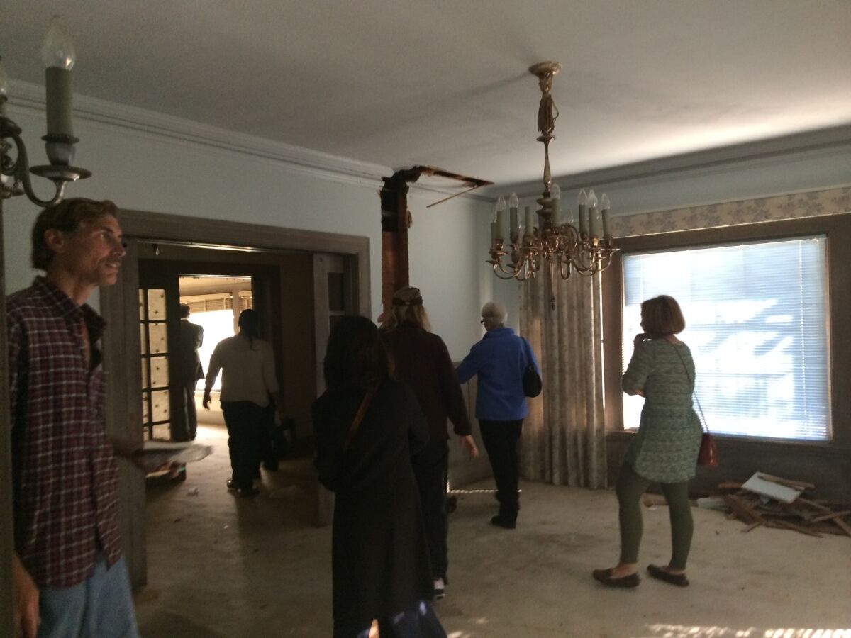 Neighbors and other members of the public walk through the Bartlett House on Kenmore Avenue in Los Feliz.