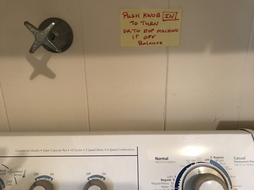 Inga's house has a Post-it Note reminder to push the washing machine dial in before turning it.