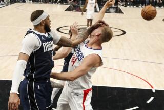 Los Angeles, CA, Wednesday, May 1, 2024 - Dallas Mavericks forward P.J. Washington (25) whacks LA Clippers center Mason Plumlee (44) in the face while battling for a rebound in game five of the NBA Western Conference playoffs at Crypto.Com Arena. (Robert Gauthier/Los Angeles Times)