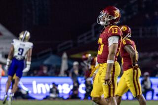 LOS ANGELES, CA - NOVEMBER 4, 2023: USC Trojans quarterback Caleb Williams (13) walks.