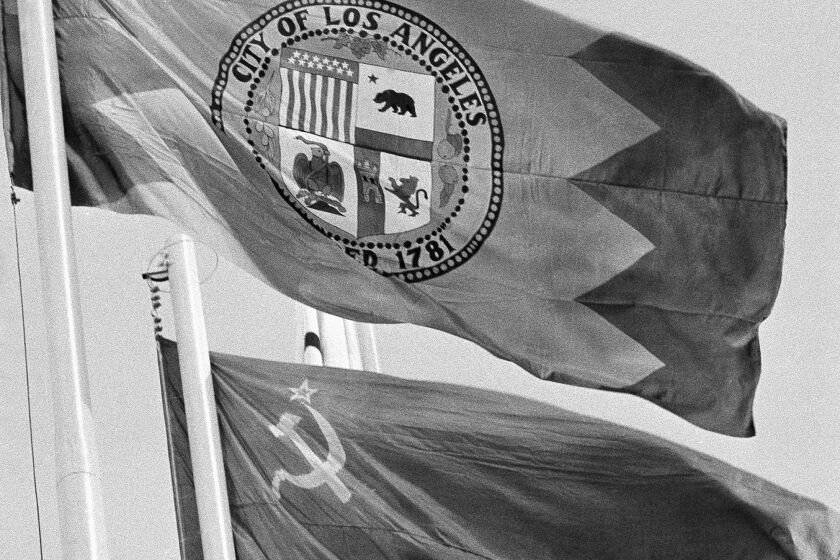 The flag of Los Angeles flies next to the flag of the Soviet Union, closing ceremony, 1980 Moscow Summer Olympics