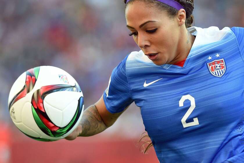 U.S. forward Sydney Leroux runs with the ball at Sweden's goal post during the Women's World Cup on June 12.