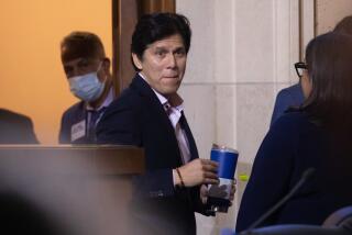 LOS ANGELES, CA - DECEMBER 09: Los Angeles City Councilman Kevin de Leon returned to council chambers after a two month absence. He was greeted by protesters and supporters. Photographed at City Hall on Friday, Dec. 9, 2022 in Los Angeles, CA. (Myung J. Chun / Los Angeles Times)