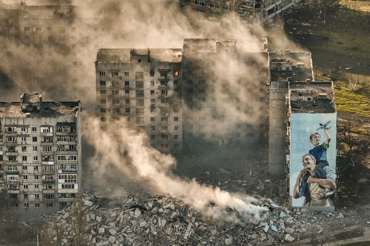 Smoke rises from a destroyed building in Bakhmut, Ukraine.