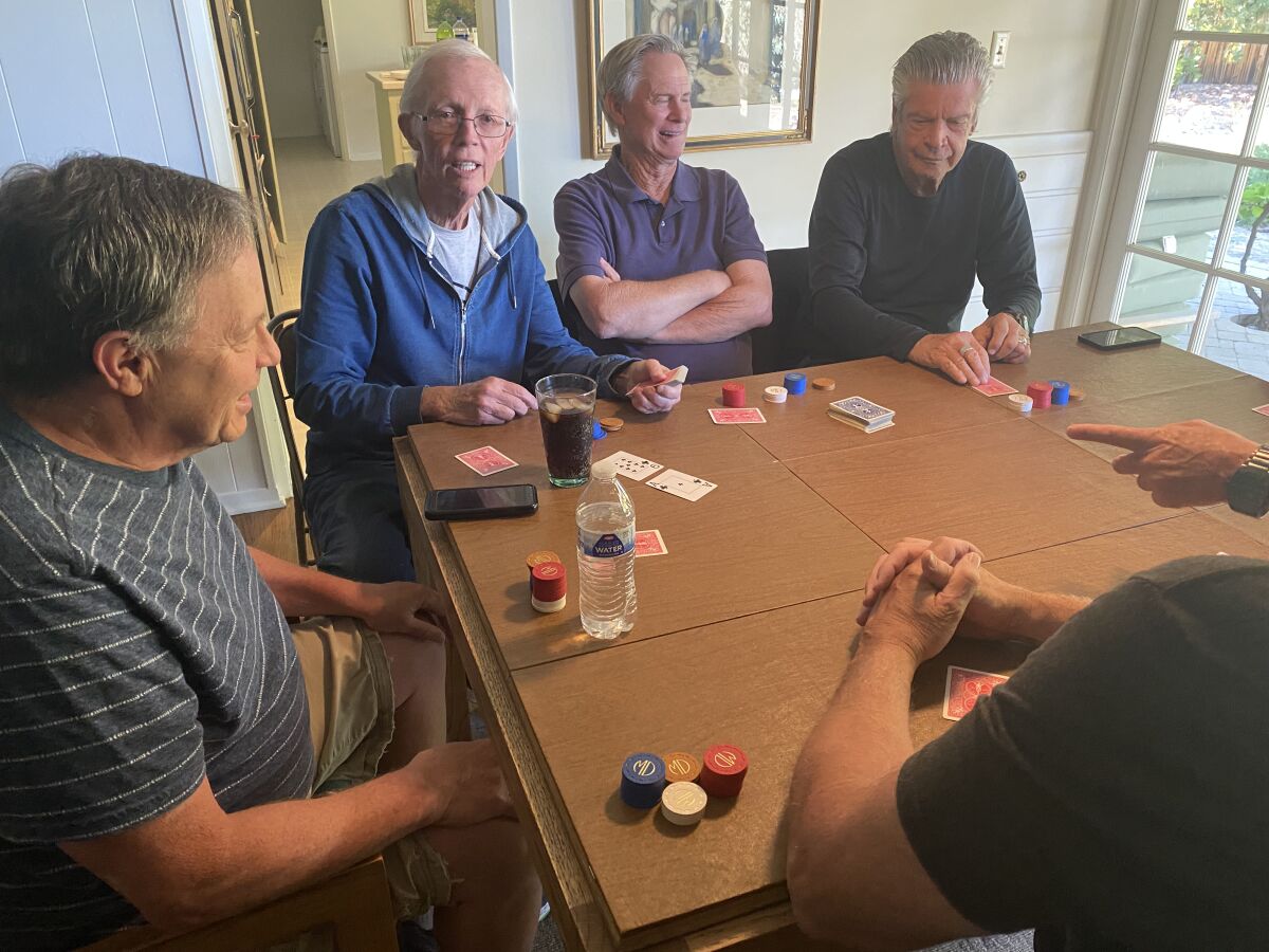 Former coaches resume their monthly poker game. Rick Prizant (left), Jim Woodard, Al Bennett and Richard Doran.