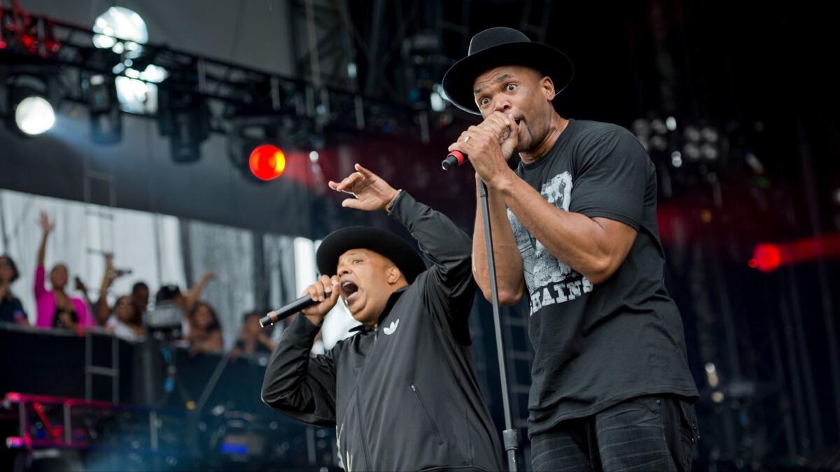 Joseph "Run" Simmons, left, and Darryl "DMC" McDaniels of Run-D.M.C. in a Sept. 2, 2012, file photo. The group has filed a $50 million trademark infringement lawsuit against Wal-Mart, Amazon and other retailers.
