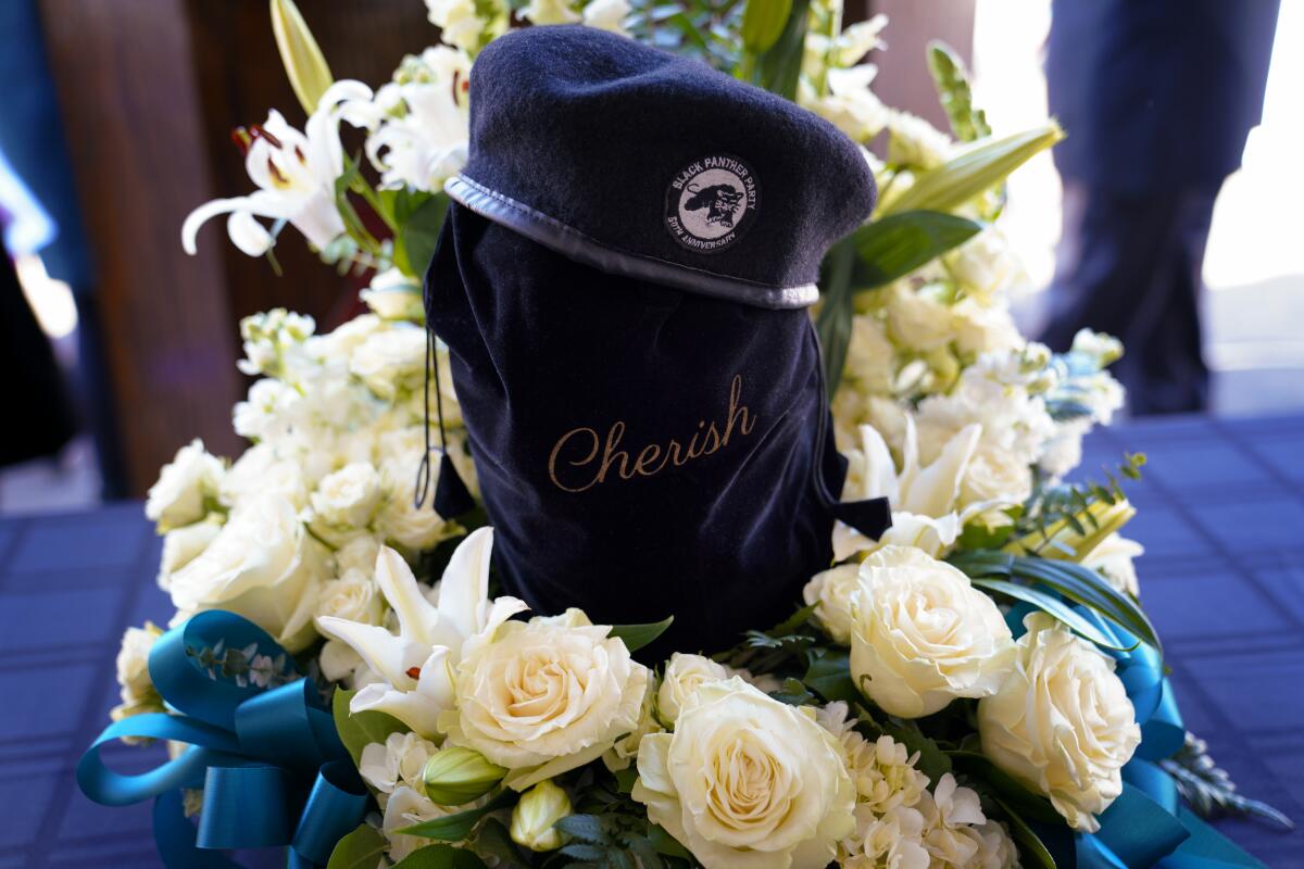 A Black Panther beret tops the vessel holding the ashes of Trunnell Price during Saturday's memorial service.