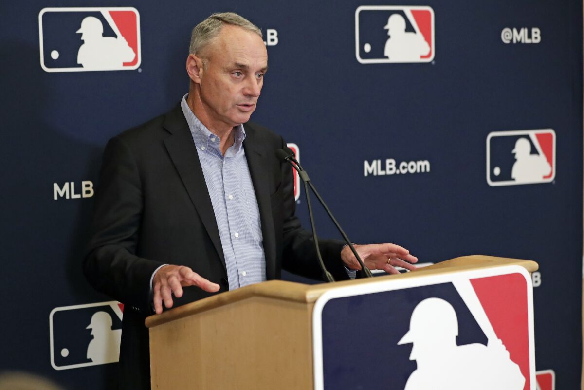 MLB commissioner Rob Manfred answers questions at a press conference Feb. 6, 2020, in Orlando, Fla.