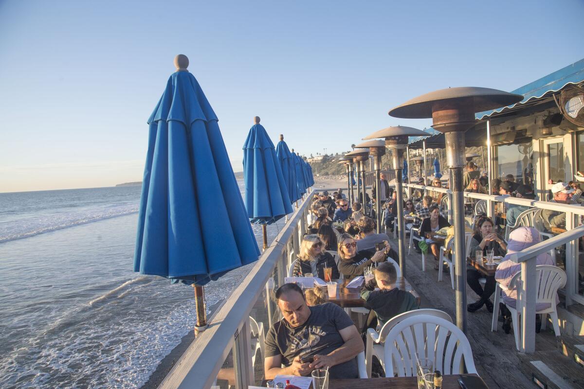 The outdoor seating area of the waterside Fisherman's Restaurant and Bar.