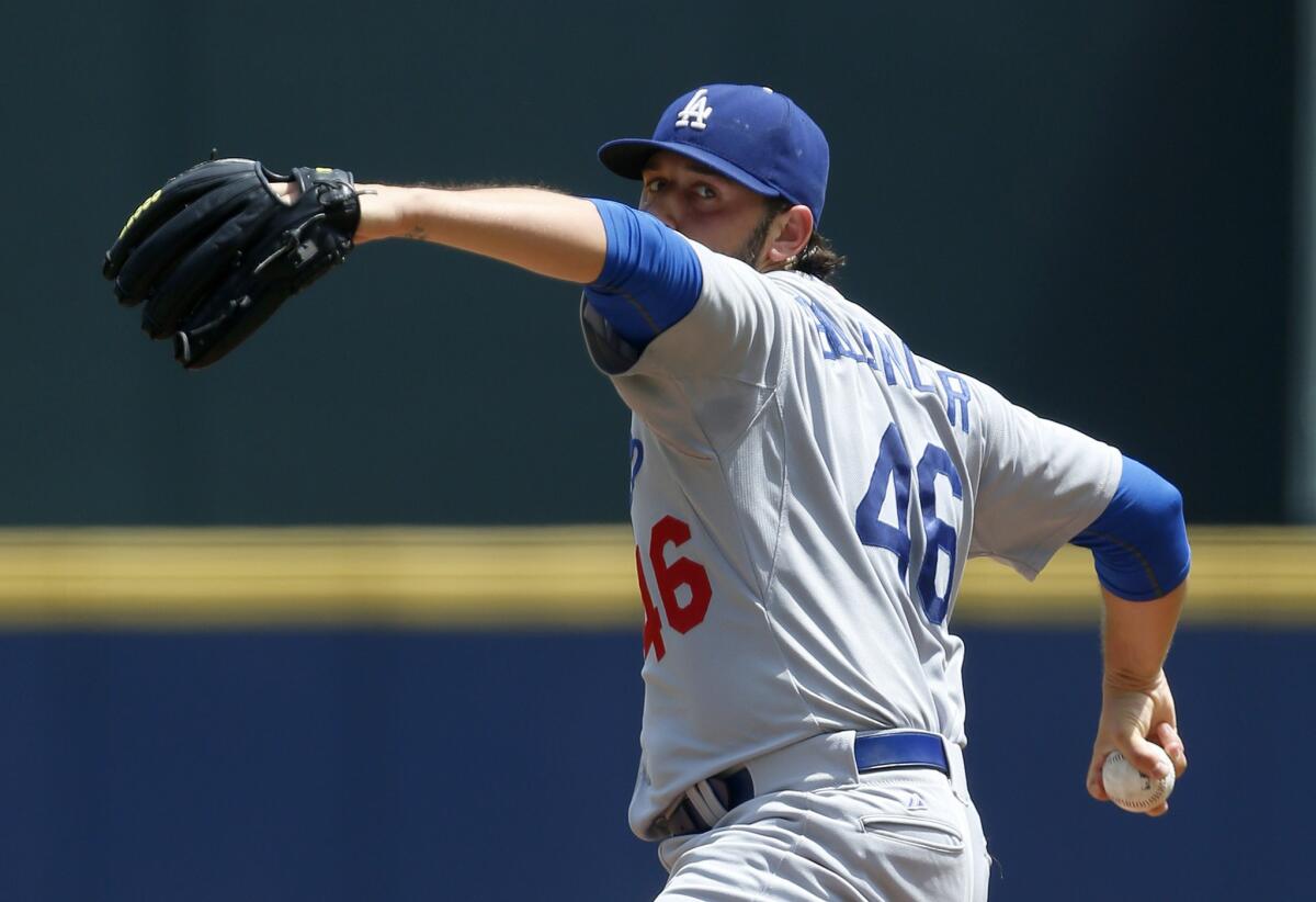 Dodgers starter Mike Bolsinger pitches against the Braves during the first inning.
