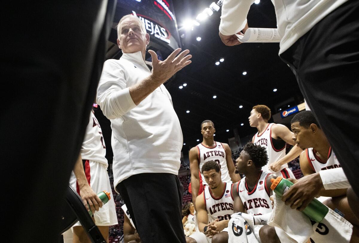 SDSU coach Brian Dutcher talks to his team during a game earlier this season.