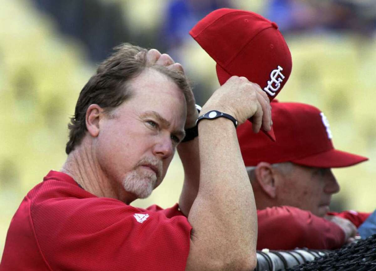 Mark McGwire is the new hitting coach for the Dodgers after three seasons in the post for St. Louis.