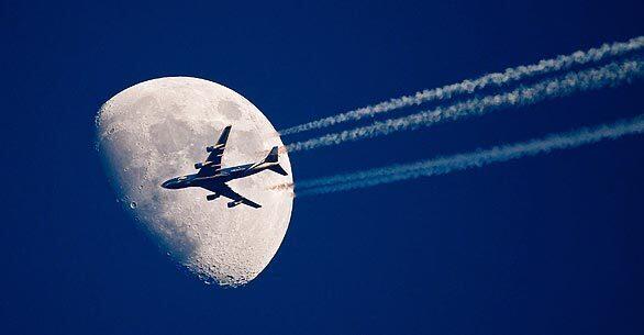Plane across the moon