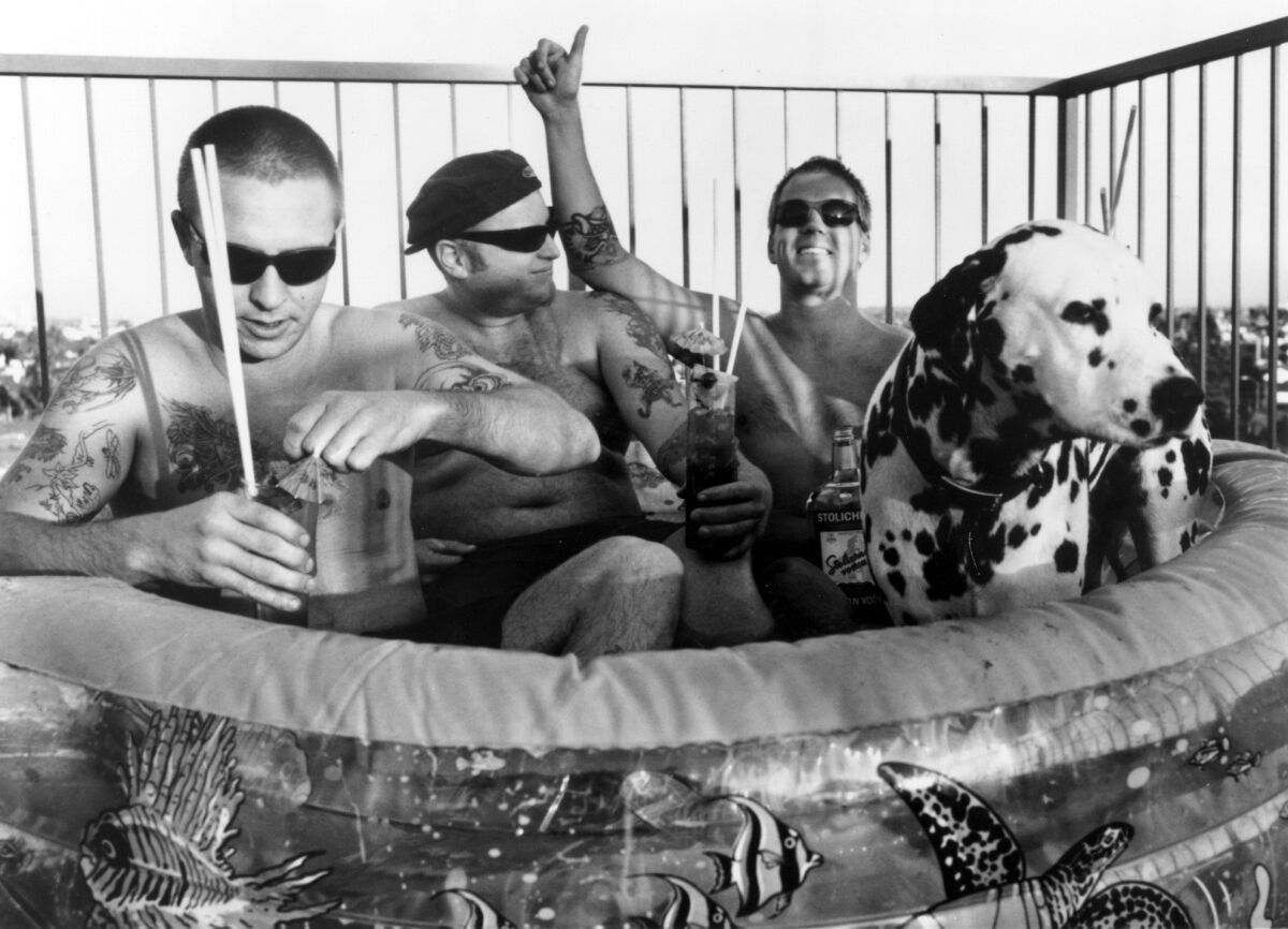 Band members Bud Gaugh (left), Eric Wilson and Brad Nowell of Sublime live it up in Long Beach in this 1995 photo. To commemorate the 20th anniversary of the band's "40 oz. to Freedom" album, the remaining band members are collaborating on a beer with San Diego brewery Alesmith. (John Dunne for the Los Angeles Times)