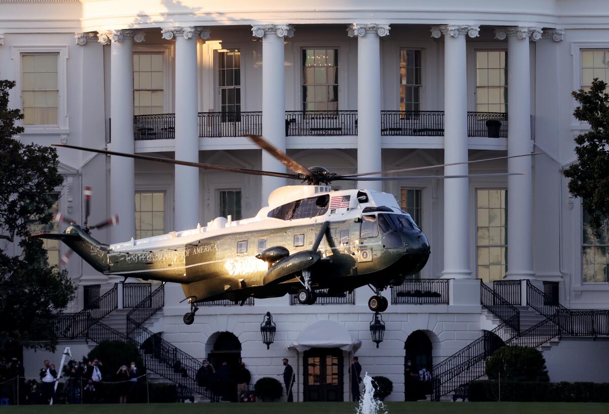 Marine One, the presidential helicopter, carries President Trump away from the White House  to Walter Reed hospital Friday. 