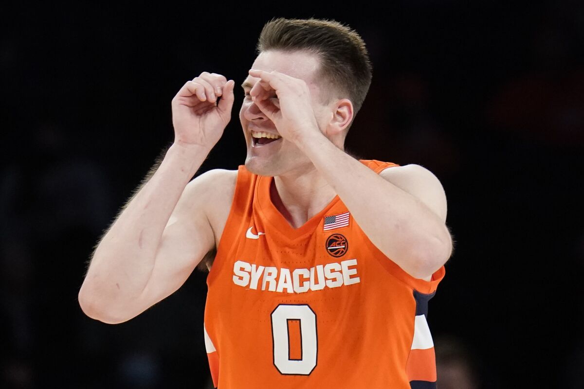 Syracuse's Jimmy Boeheim (0) reacts after scoring in the first half of an NCAA college basketball game against Florida State during the Atlantic Coast Conference men's tournament, Wednesday, March 9, 2022, in New York. (AP Photo/John Minchillo)