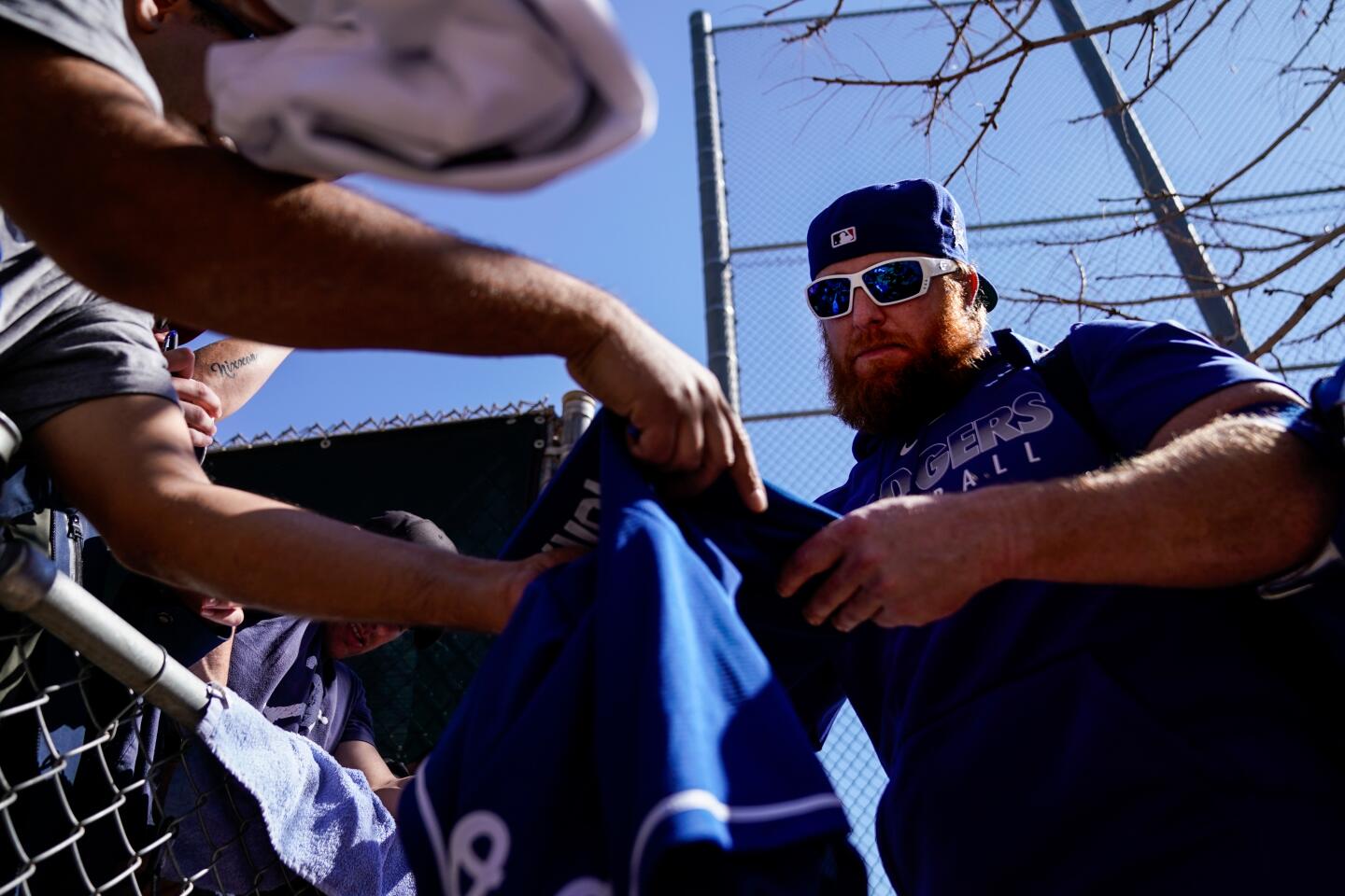 Dodgers slugger Justin Turner autographs memorabilia for fans during spring training at Camelback Ranch