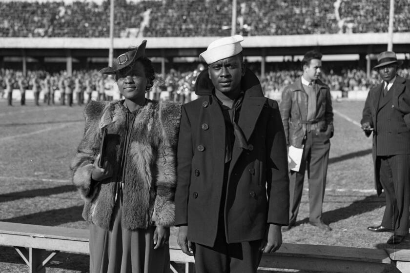 Charles Jackson French with his sister, Viola, at a Creighton University football game on Oct. 31, 1942.