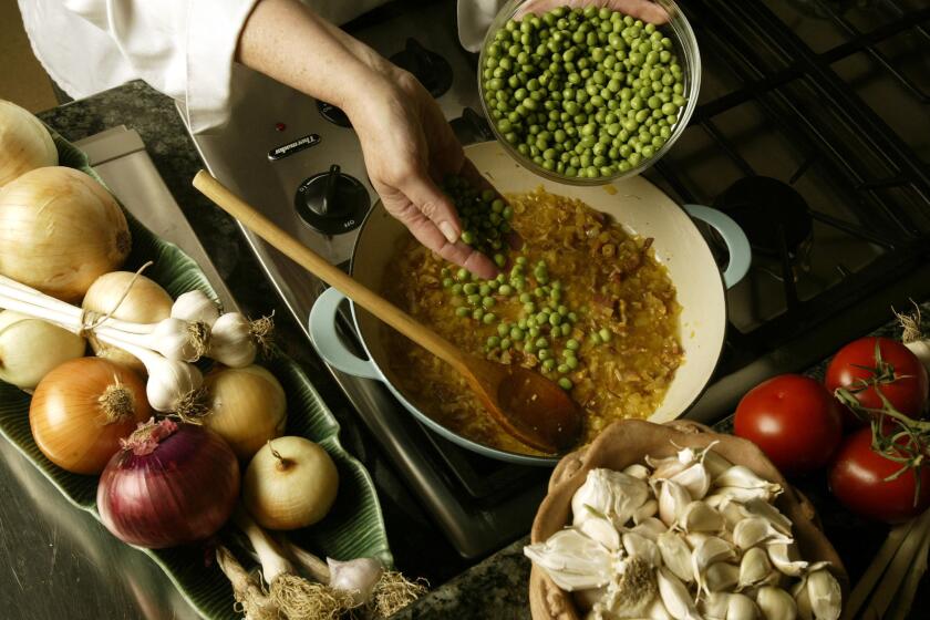 082249.FO.0520.calcook.seafood.MJC -- Seafood stew with green peas.