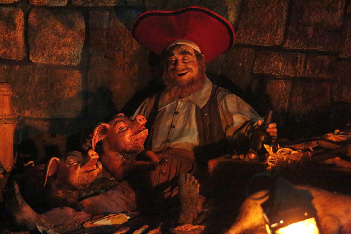 A pirate and pigs from the Pirates of the Caribbean ride