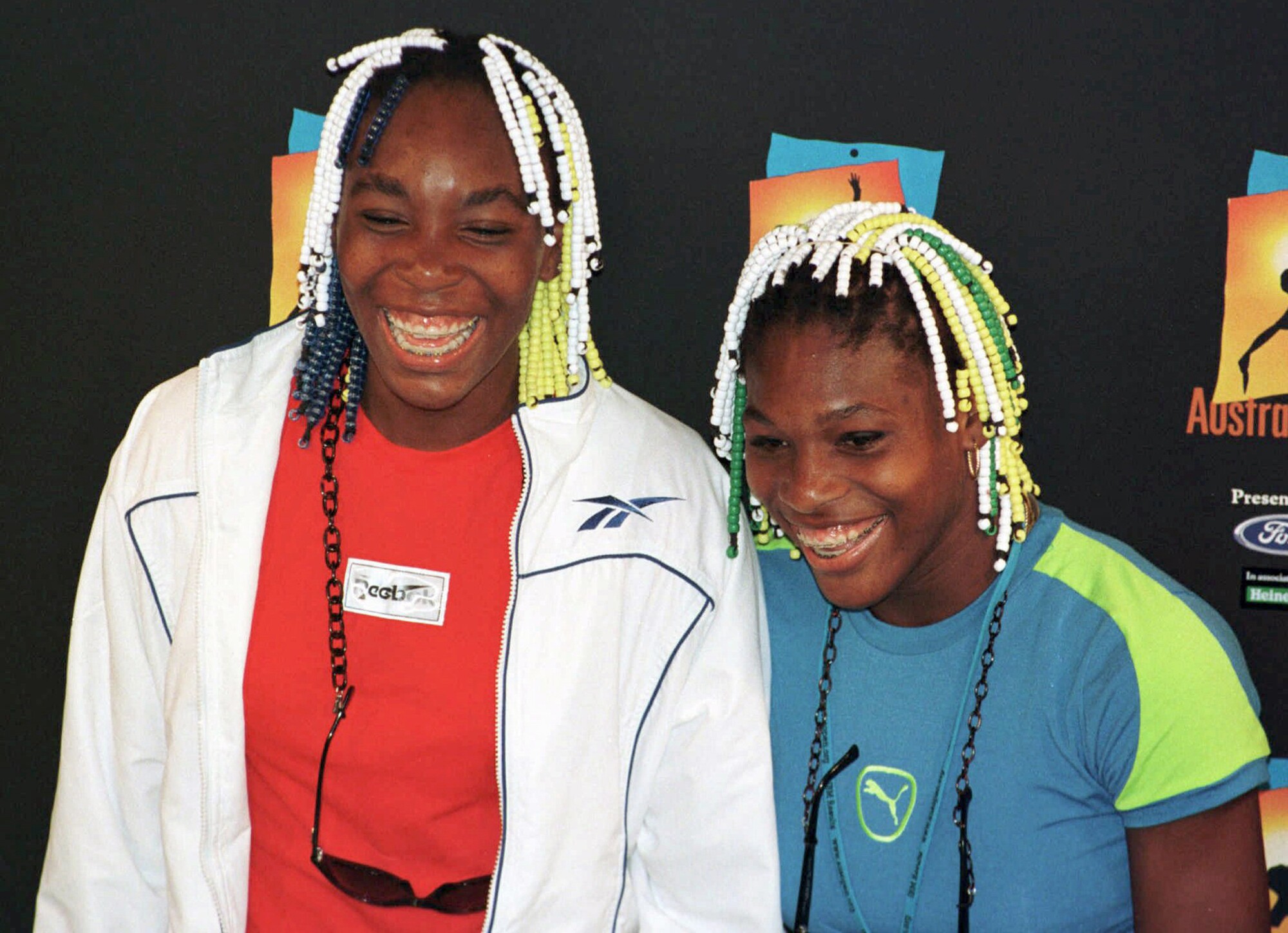 Venus, left, and Serena Williams smile during a news conference at the 1998 Australian Open.