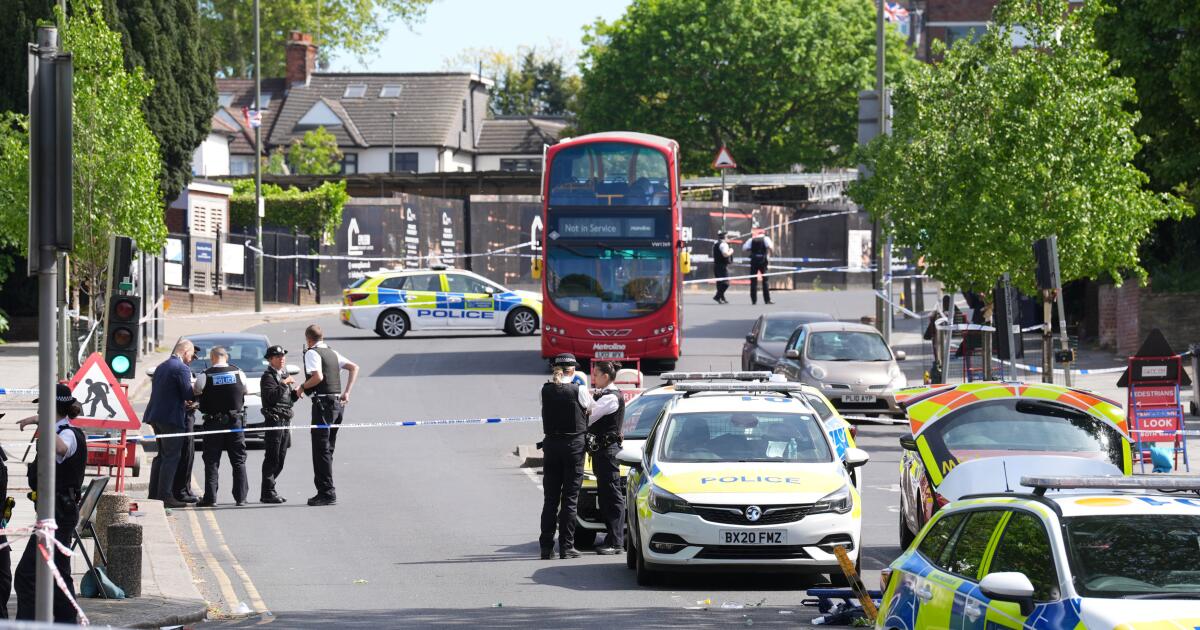 Police at the scene where two people were stabbed Wednesday April 29, 2026 in a London neighborhood with a large Jewish community and a 45-year-old man was arrested on suspicion of attempted murder over what authorities called an antisemitic attack. (Lucy North/PA via AP)