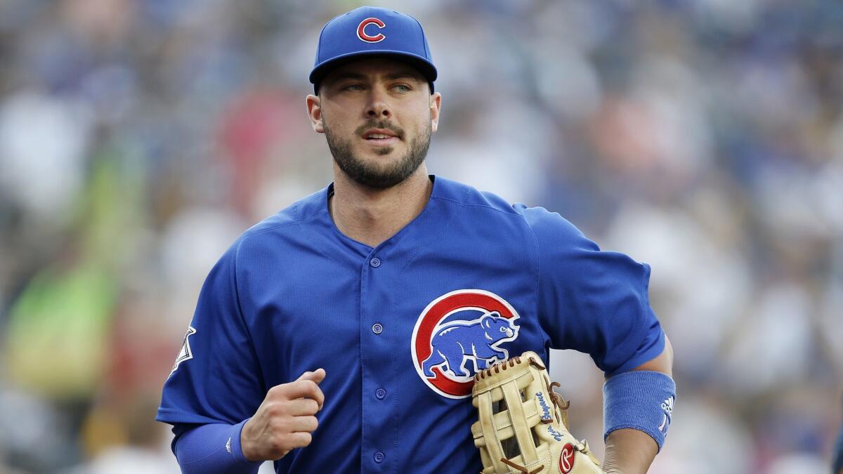 Chicago Cubs third baseman Kris Bryant runs into the clubhouse after warm ups.